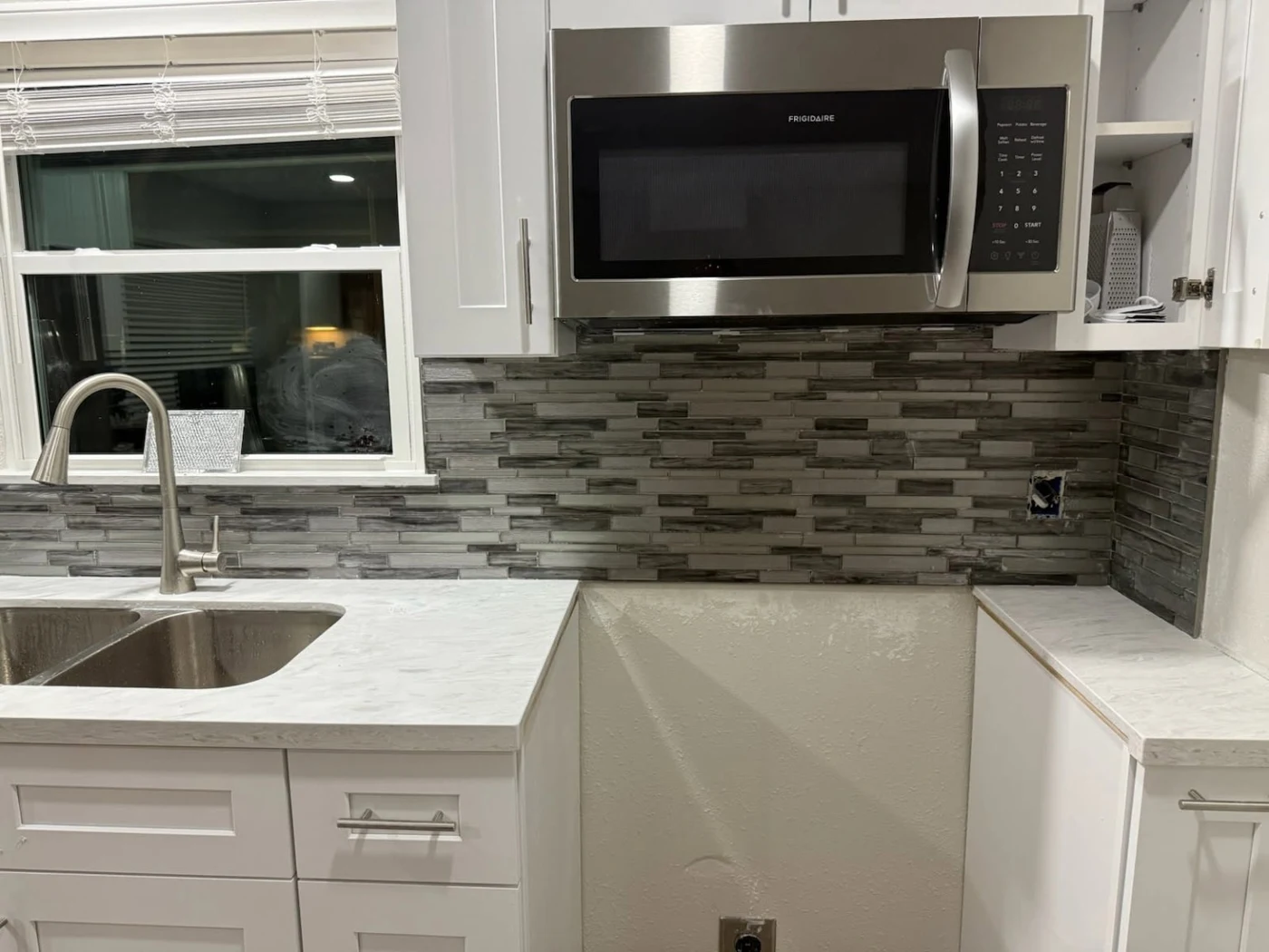Kitchen with a newly installed tile backsplash in Allen