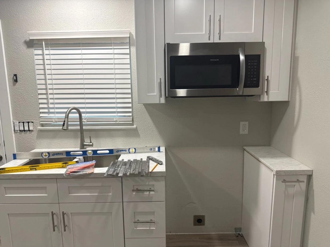 Kitchen wall before backsplash installation in Allen