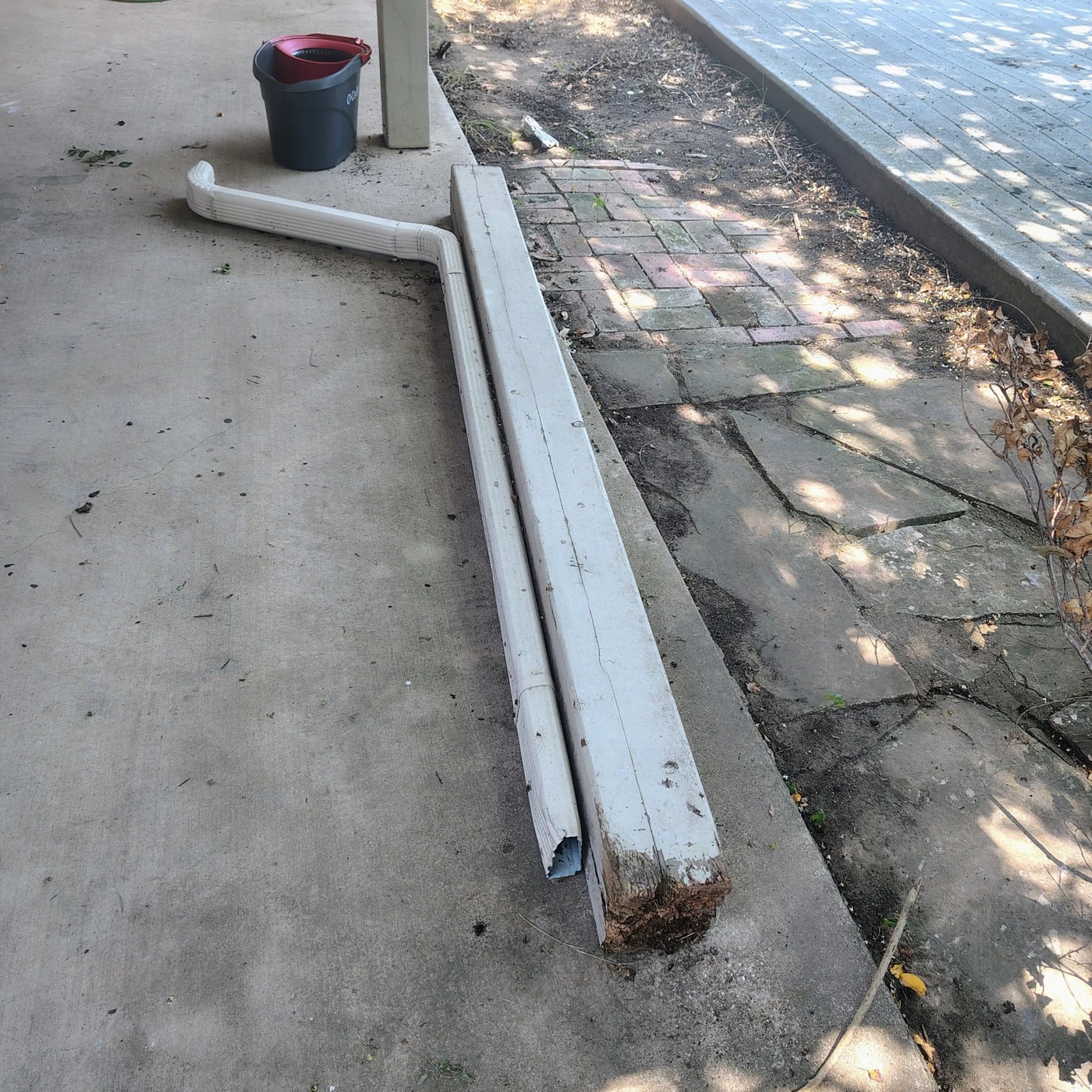 Removed patio support post with a deteriorated bottom in Ennis