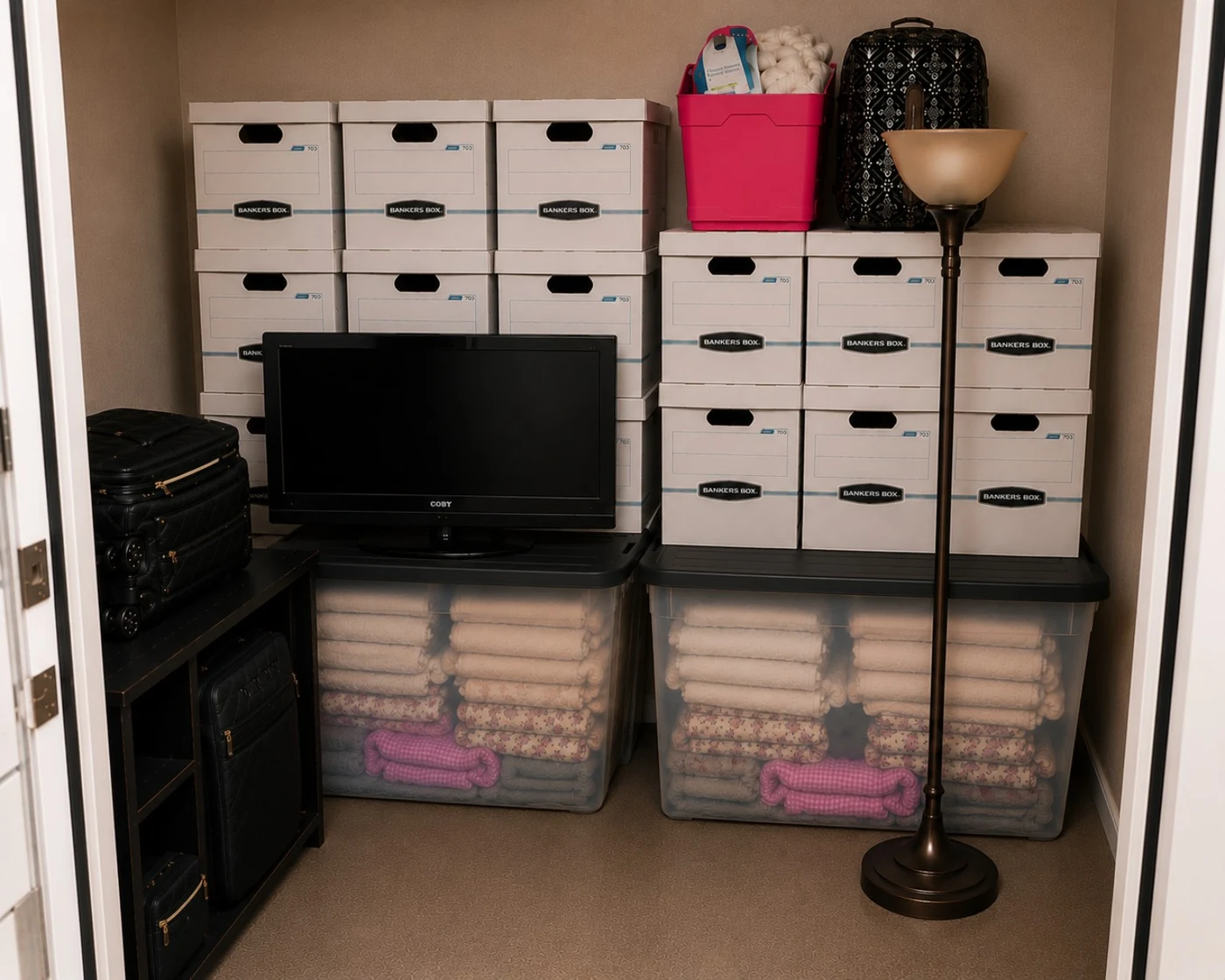 Finished apartment storage arrangement with stacked boxes and belongings