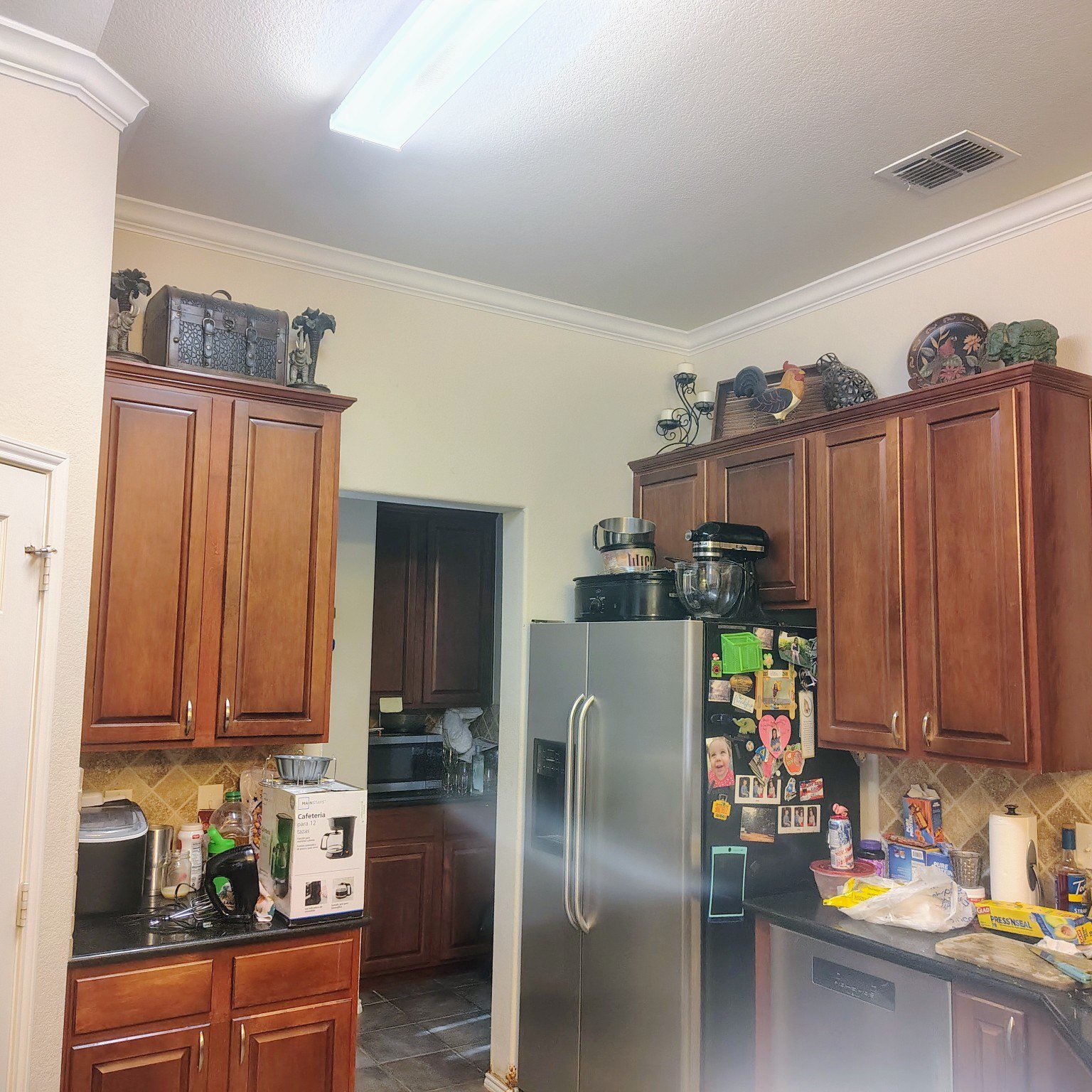 Kitchen before painting, with light walls