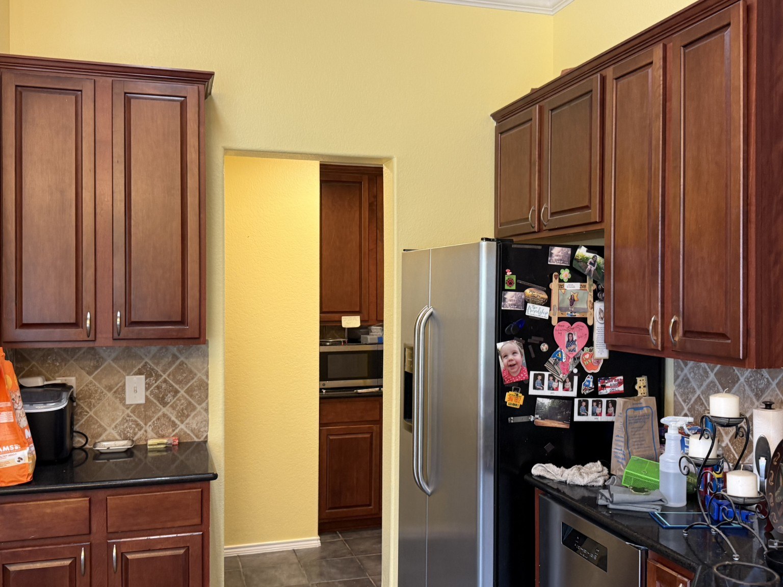 Kitchen after painting, with yellow walls