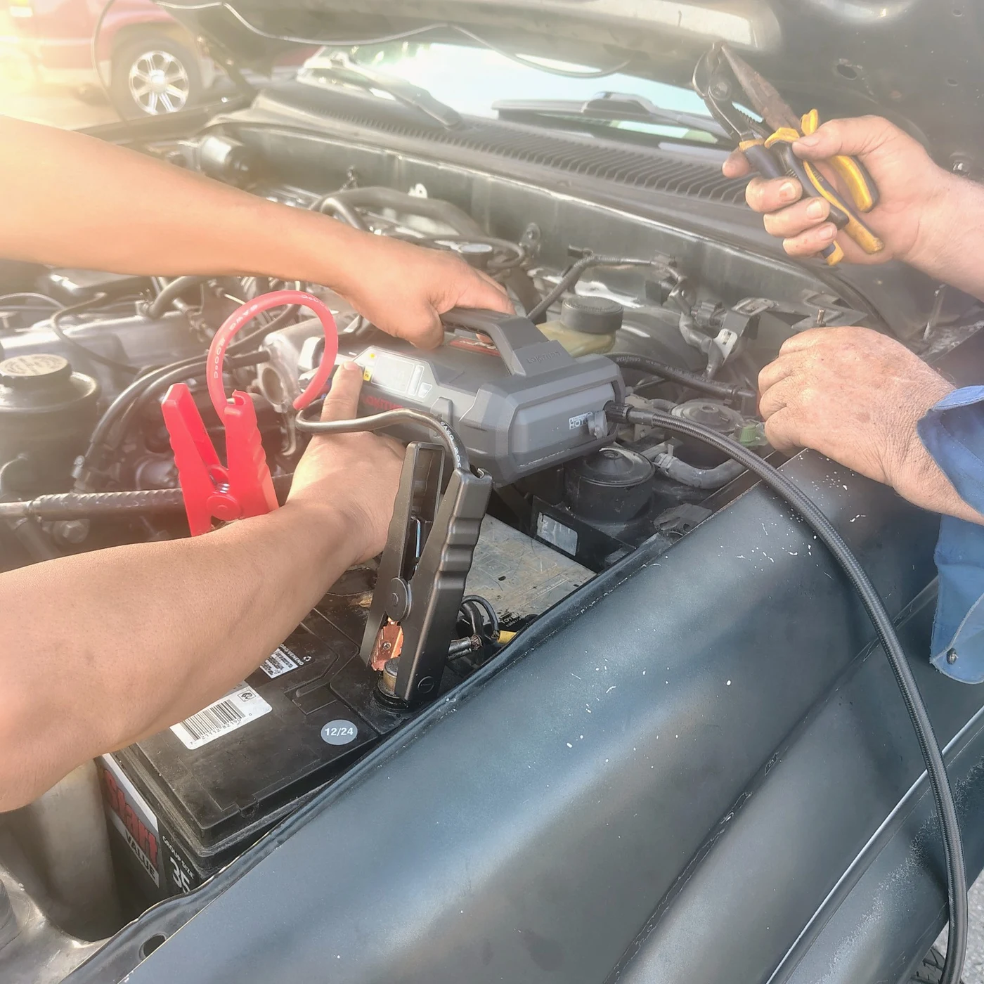 Battery boost being provided to the stalled vehicle in West Oak Cliff